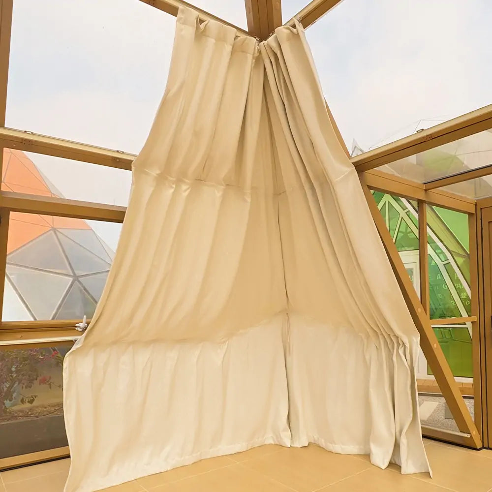 pyramid glass house with curtain